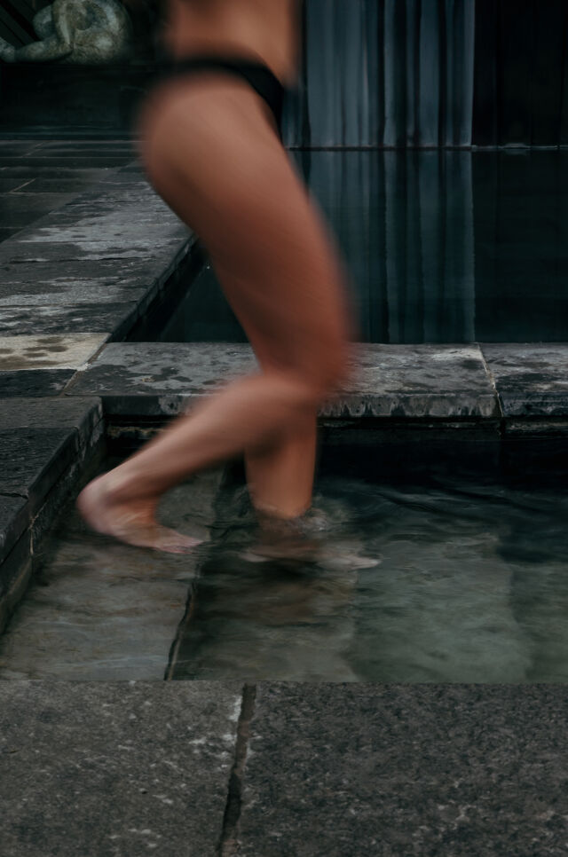 Woman steps into bath