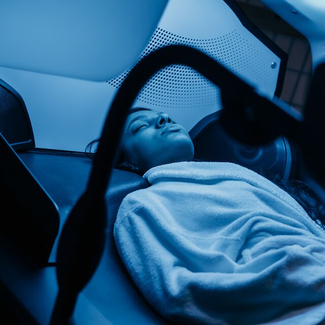 Woman enjoying a Hydrojet Massage included in her RISE+ package