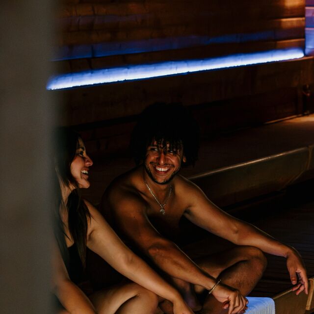 Two friends having a deep converstation in a sauna